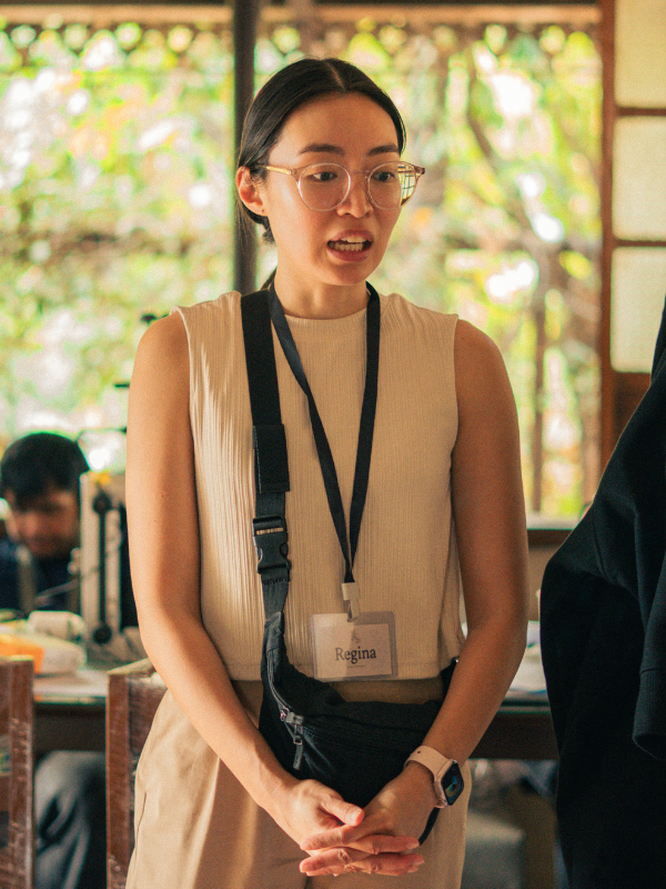 Regina De Vera on set — "What the Living Do," 2026